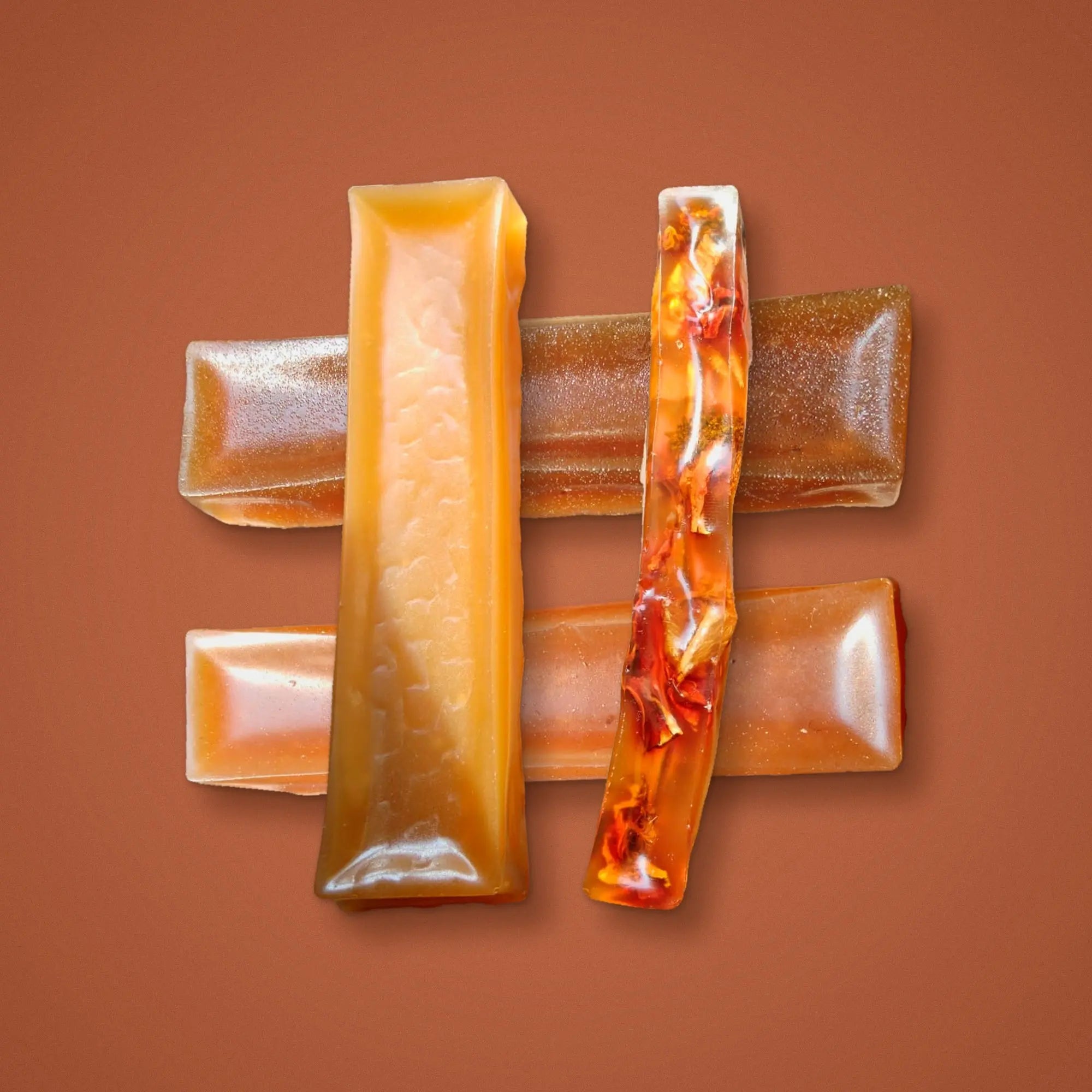 Grid of four bone broth dog chews, each on its own coloured background: teal, blush, sage and peach. BARF INDIA